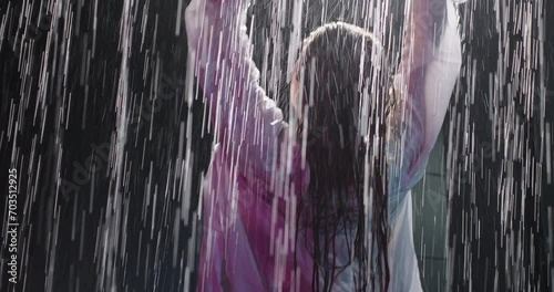 Sexy woman under shower, enjoy flowing water. Water drops flow down the body. Wet woman in lingerie
