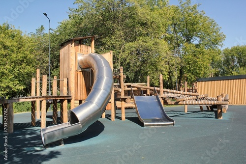 Принти на полотні Wooden playground made of natural eco-friendly material in public city park