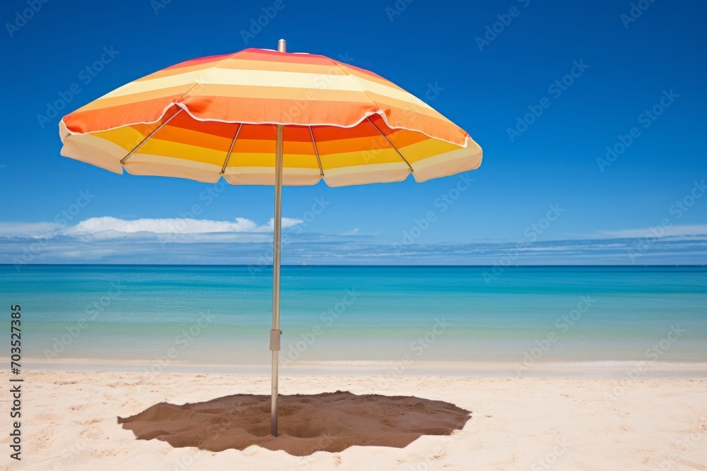 Beach umbrella on the beach near the ocean on a bright sunny day