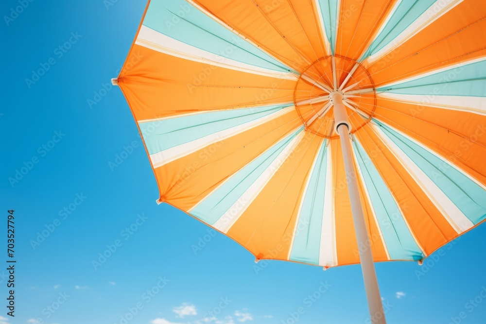 Beach umbrella against a blue sky