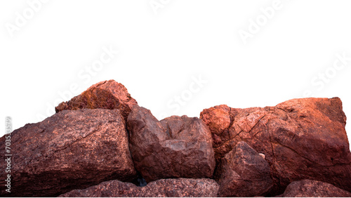 Big seaside rock texture on white background. Panoramic Mediterranean close up red stones.