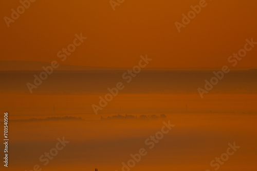 Sunrise landscape, colorful warm cold nature, world, river, hills and village © Stefana