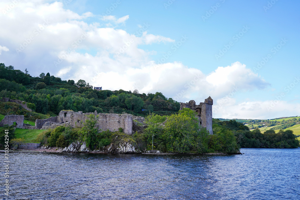 Urquhart Castle ruins and Loch Ness in the Scottish highlands. Urquhart Castle ruins and Loch Ness in the Scottish highlands.