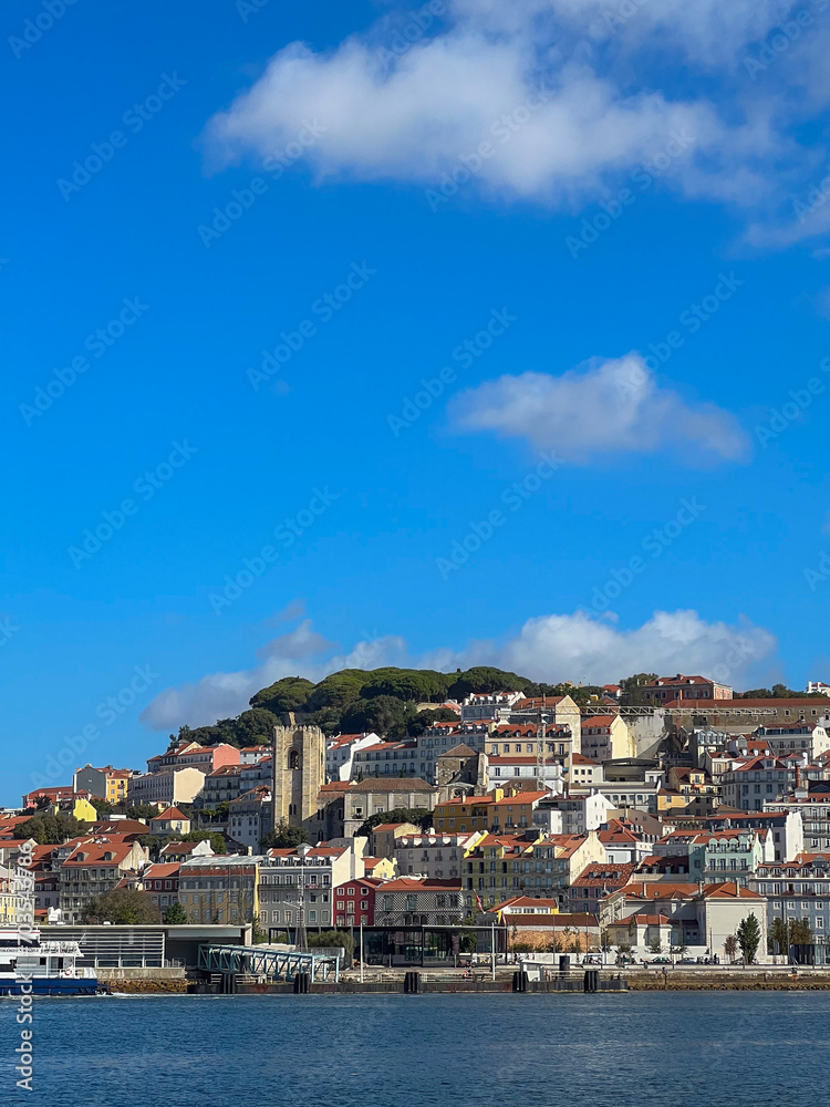 Lisbon Cathedral among the city buildings seen from Tagus River