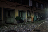 old house in the city of Rapperswil, picutre taken by night in the streetlight, shadows and light