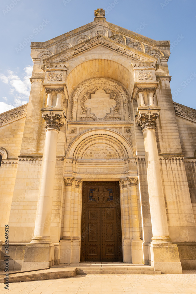 entrance to Collégiale Saint Martin et Tour Charlemagne Tours,  Basilica religious building outside on sunny summer day 
