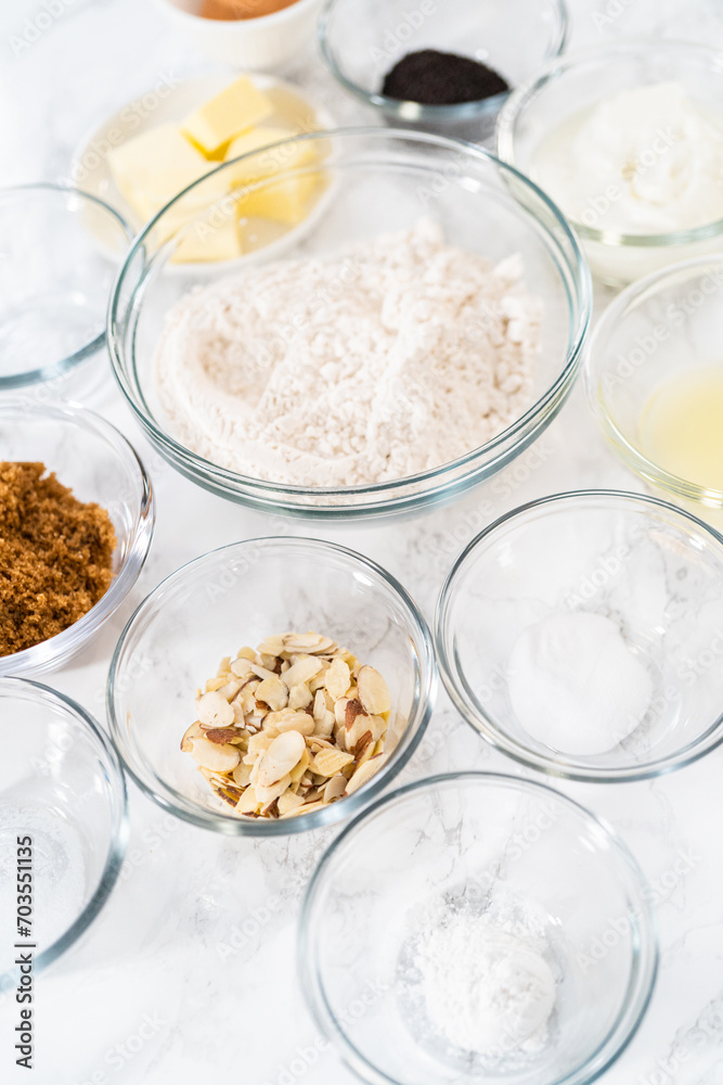 Lemon poppy seed muffins garnished with almond slivers