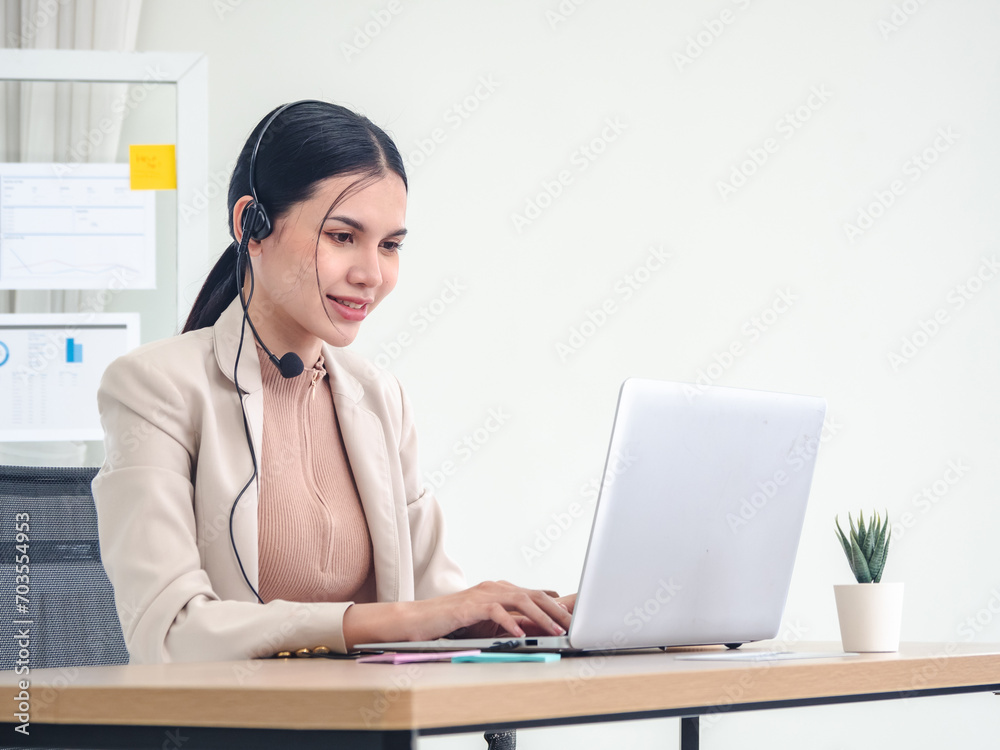 Portrait woman girl Asian one person smile happy enjoy sitting chair on desk looking hand holding notebook laptop ready for business service call center working job online sale inside the room office Portrait woman girl Asian one person smile happy enjoy sitting chair on desk looking hand holding notebook laptop ready for business service call center working job online sale inside the room office