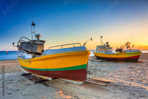 Fishing boats on the beach of Baltic Sea in Sopot at sunrise, Poland