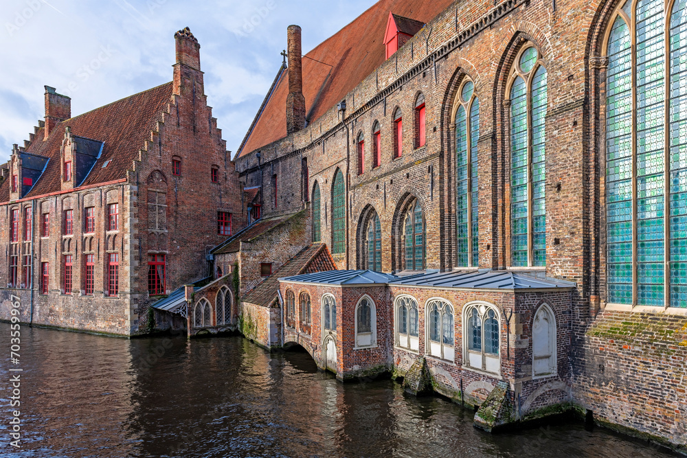 Traditional medieval canal architecture with brick walls, Bruges, Flanders, Belgium.