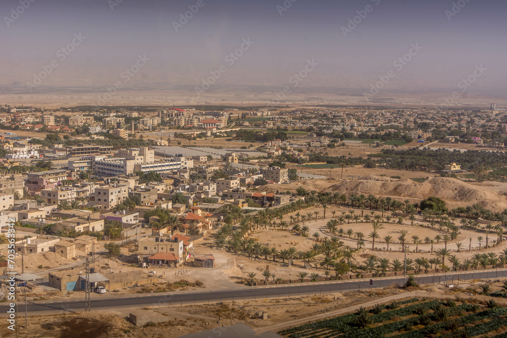 The aerial view on downtown of the Palestinian city of Jericho, West Bank, Palestine, during the hot summer day.