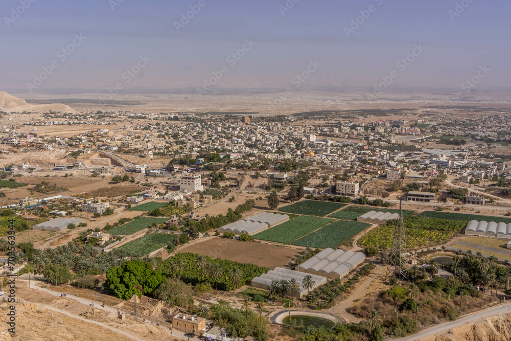 The aerial view on the farms, and residential houses at Jericho, West Bank, Palestine, during the hot summer day.