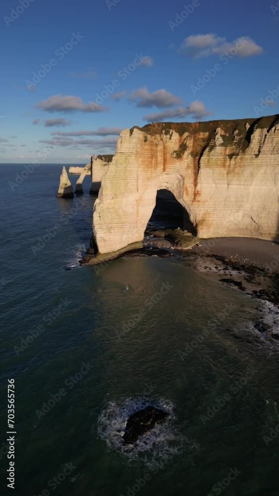 Aerial 4k drone view of Etretat. L'Aiguille, The Needle, Famous Alabaster chalk seacoast, Porte Aval cliffs, Natural Rock Arch Of Étretat, Normandy, France, Atlantic Ocean, French holidays, landscape Aerial 4k drone view of Etretat. L'Aiguille, The Needle, Famous Alabaster chalk seacoast, Porte Aval cliffs, Natural Rock Arch Of Étretat, Normandy, France, Atlantic Ocean, French holidays, landscape