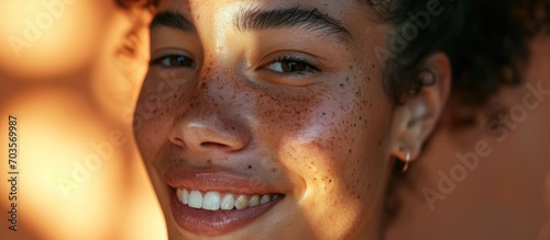 Happy woman using beauty products for healthy skincare and aesthetic shine. Young model with face freckles using cosmetic products and sunscreen for wellness and melasma. photo