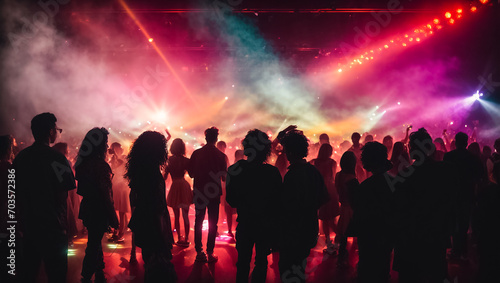 Silhouettes of people at a disco audience