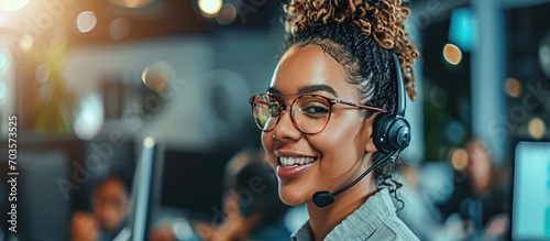 Cheerful call centre worker focused on their work and posing for the camera.