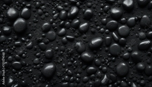 Black pebbles on black background