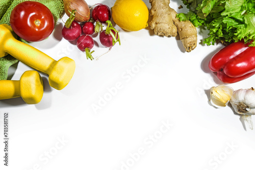 Fototapeta Naklejka Na Ścianę i Meble -  Dumbbells, vegetables and lettuce, fitness concept for a healthy vegetarian slimming diet and sport exercising, top view from above on a white background, copy space