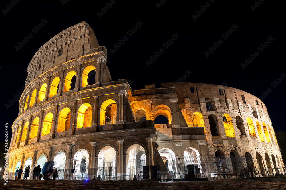 Exterior Architectural Sights of The Roman Colosseum (Colosseo Romano) in Rome, Lazio Province, Italy. (At Night).
