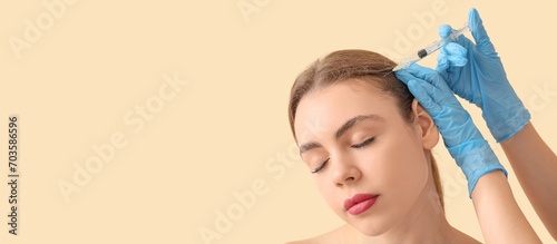 Young woman receiving fille...