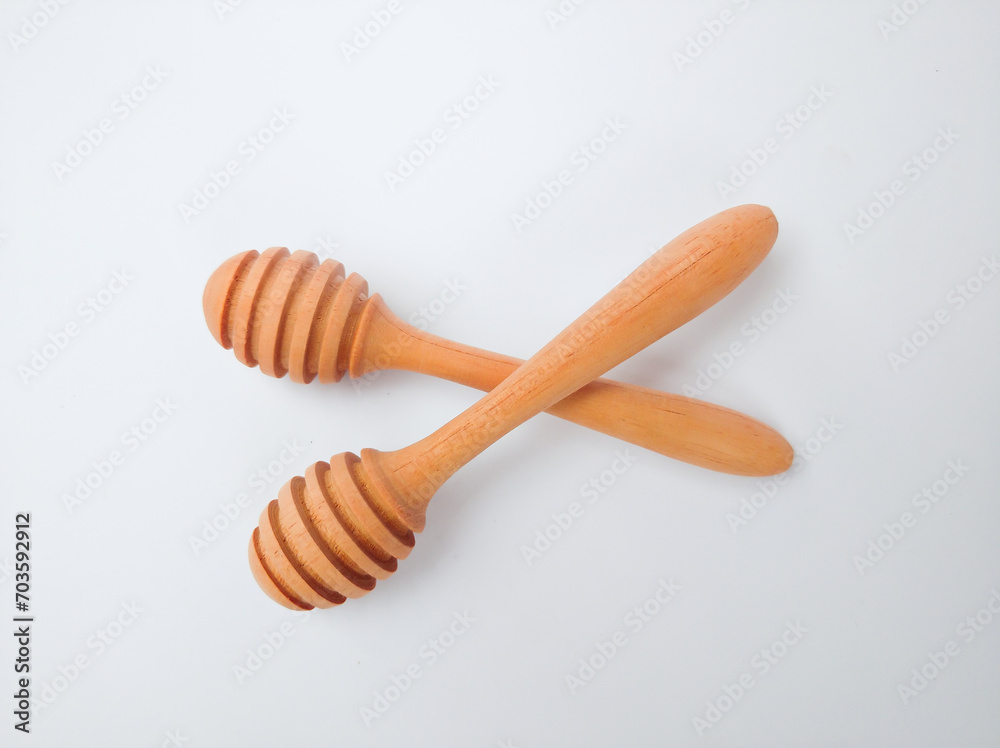 Wooden honey spoon isolated on white background Wooden honey spoon isolated on white background