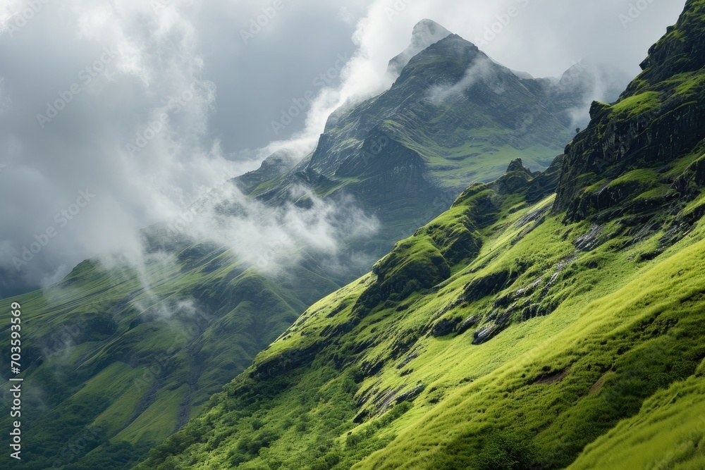 A breathtaking view of the highland landscape, as a sea of clouds envelops the green mountain range and distant fells, creating a serene and ethereal atmosphere A breathtaking view of the highland landscape, as a sea of clouds envelops the green mountain range and distant fells, creating a serene and ethereal atmosphere