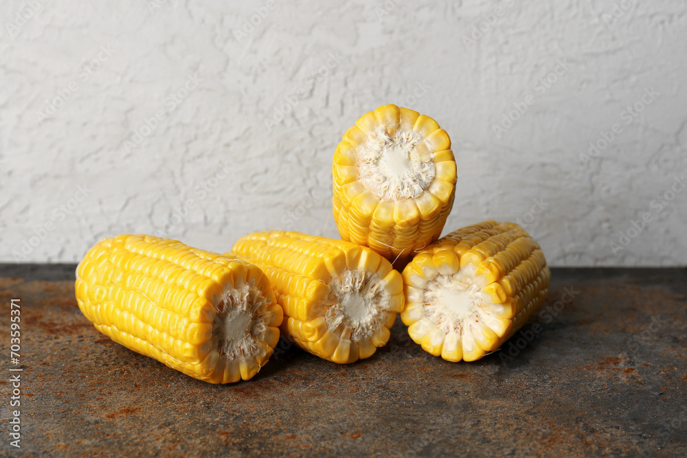 Cut fresh corn cobs on dark table Cut fresh corn cobs on dark table