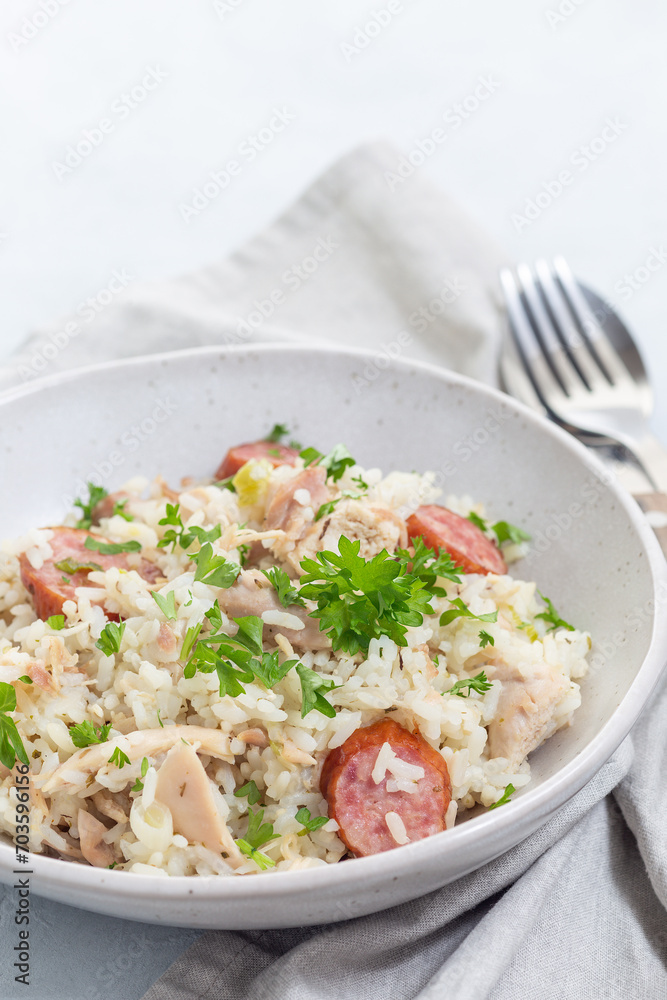 Homemade South Carolina chicken bog dish with smocked sausages, in bowl, vertical, copy space Homemade South Carolina chicken bog dish with smocked sausages, in bowl, vertical, copy space
