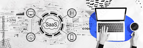 SaaS - software as a service concept with person using a laptop computer photo