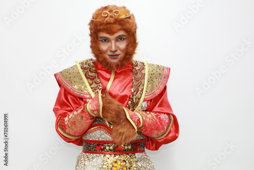 A young Asian man dressed as a monkey king participates in the Chinese New Year parade, Chinese culture