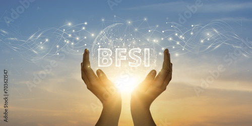BFSI: Man Holding Global Network and Connecting Data of Banking, Financial Services, and Insurance with Business on the Internet, Financial Transactions, Seamless Integration.