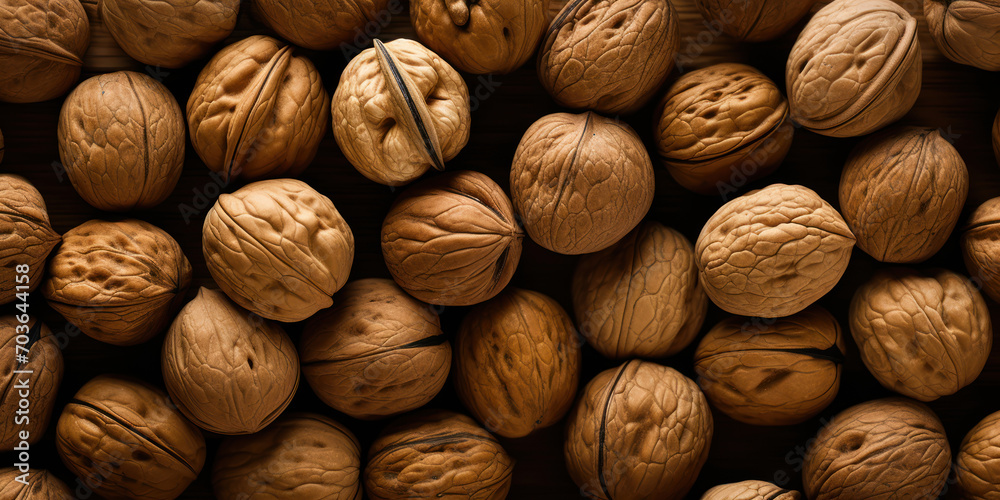 Cluster of ripe walnuts gathered together, showcasing their natural textures Cluster of ripe walnuts gathered together, showcasing their natural textures
