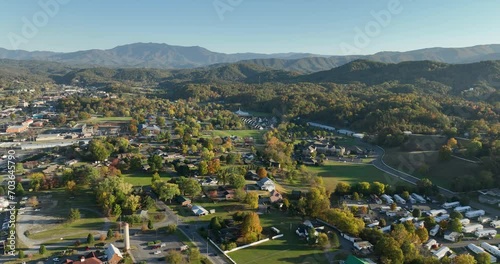 Aerial above Pigeon Forge with Great Smoky Mountains in the background, Tennessee