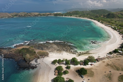 Aerial view of Tanjung Aan beach in Lombok Island, West Nusa Tenggara, Indonesia. Turquoise crystal clear water beach in tropical island. 