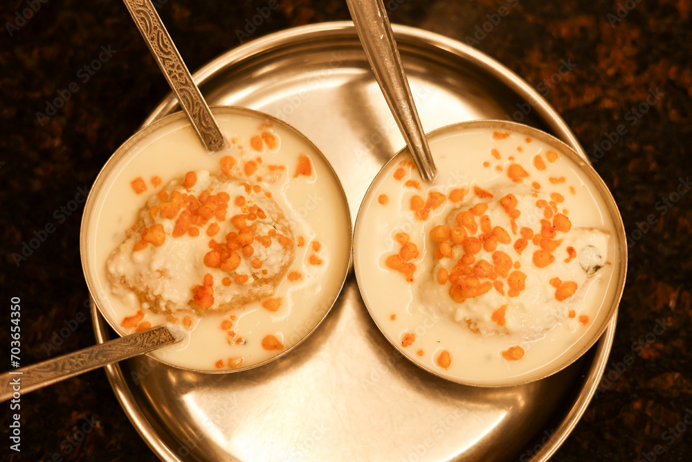 Indian street food thayir vadai Dahi vada Bhalla with green chutney
