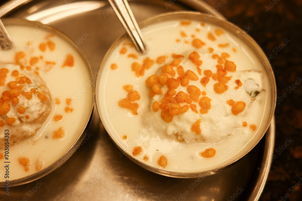 Indian street food thayir vadai Dahi vada Bhalla with green chutney