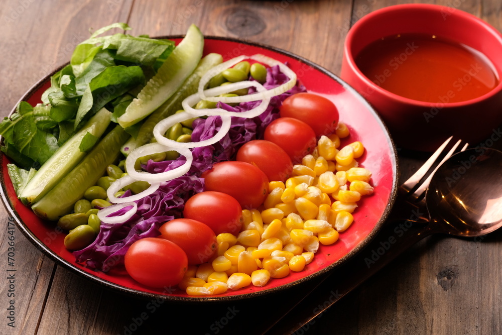 fresh vegetable salad, edamame, sweetcorn, cherry tomatoes, romaine lettuce, sliced cucumber