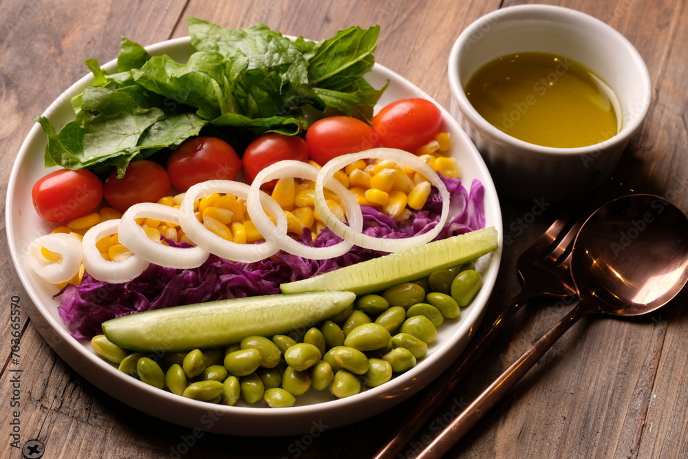fresh vegetable salad, edamame, sweetcorn, cherry tomatoes, romaine lettuce, sliced cucumber