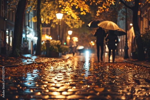 : Wet cobblestone paths reflecting the city lights, anonymous figures strolling beneath umbrellas amidst a carpet of golden leaves on a rainy night.