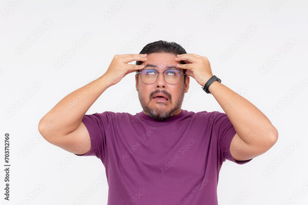 A middle aged man going crazy, rolling his eyes up, going loco. Isolated on a white background. A middle aged man going crazy, rolling his eyes up, going loco. Isolated on a white background.