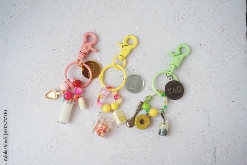 Colorful key chain made of resin and clay on a white background. Colorful key chain