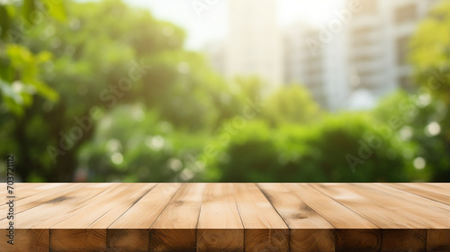 empty wooden table with blur montage outdoor garden background photo