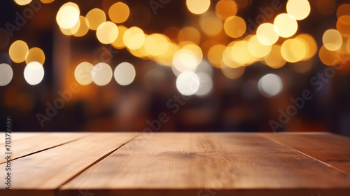 Christmas background design with empty wooden table top on blur light golden bokeh background