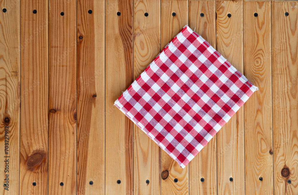 top view with red empty kitchen napkin isolated on table background. Folded cloth for mockup with copy space, Flat lay. Minimal style. High quality photo top view with red empty kitchen napkin isolated on table background. Folded cloth for mockup with copy space, Flat lay. Minimal style. High quality photo
