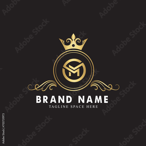 letter M ornamental logo concept with golden crown