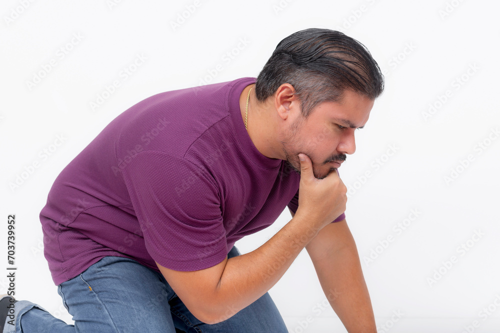 A curious man kneeling, looking at something at the ground trying to figure it out. Isolated on a white background. A curious man kneeling, looking at something at the ground trying to figure it out. Isolated on a white background.