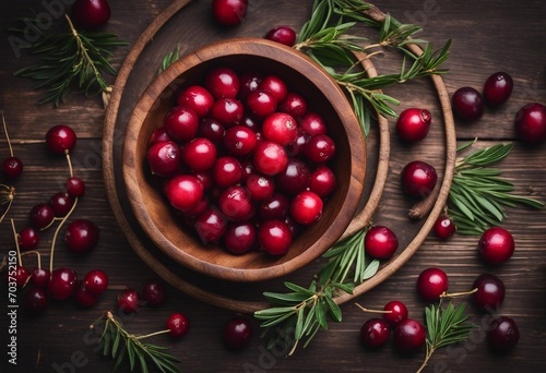 Ripe fresh cranberry in wooden bowl on rustic table top view