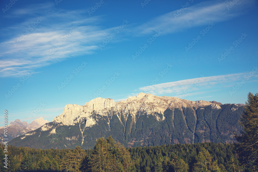 Mountain landscape in spring. The mountain is covered with snow. Vallaccia Peak. San Giovanni di Fassa, Trentino, Italy Mountain landscape in spring. The mountain is covered with snow. Vallaccia Peak. San Giovanni di Fassa, Trentino, Italy