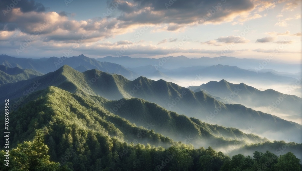 a view of a mountain range covered in mist
