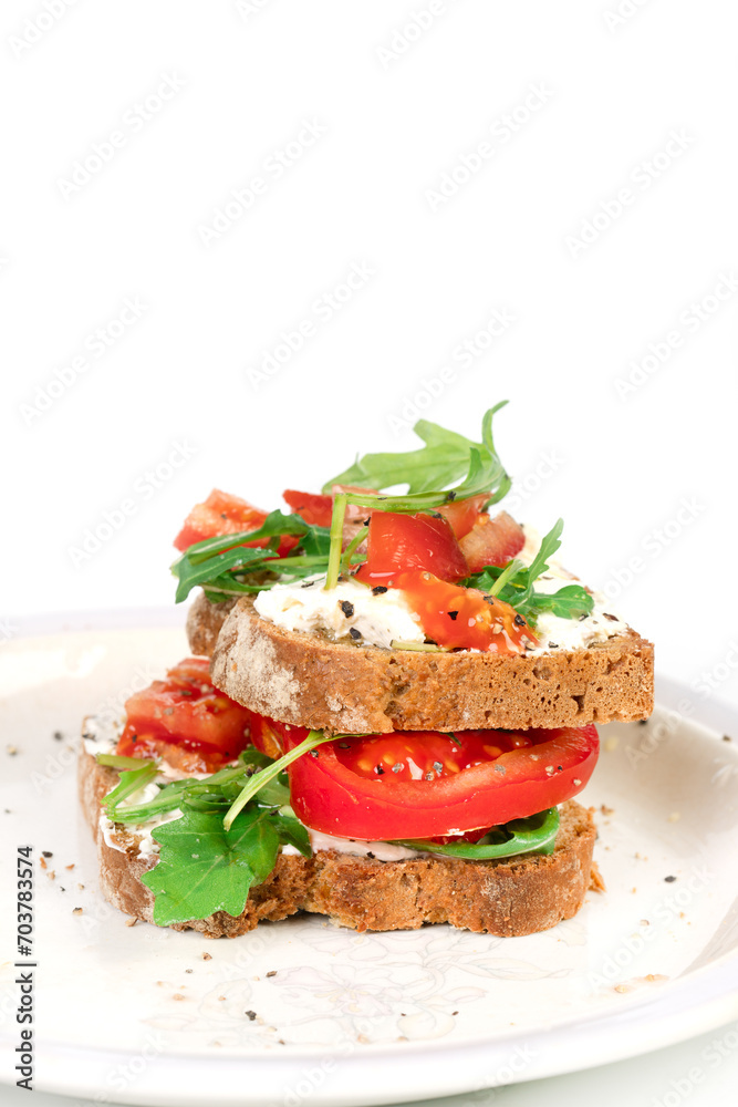 Sandwiches with soft cheese and herbs and tomatoes